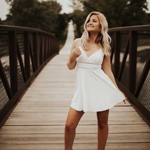 Francesca’s “Quinn Ladder Trim Dress” in white